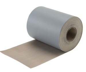 A roll of industrial gray foam insulation partially unrolled, showing its layered composition and cylindrical shape.