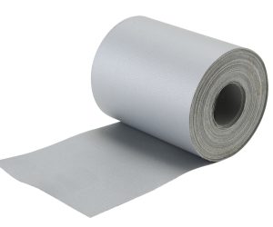 A roll of gray foam insulation partially unrolled on a white background.